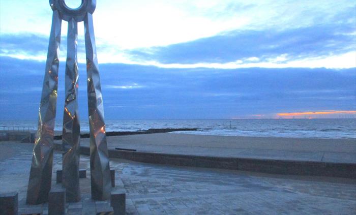 A 6 meter tall statue of a ring on 3 legs, It is called the beginning and end statue to signify the start or finish of the Offa's Dyke Path. It is loc